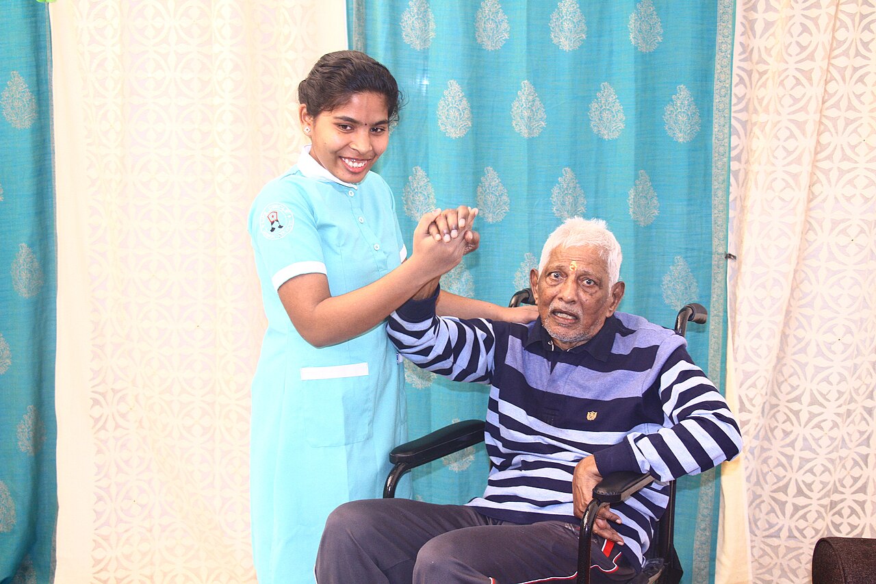 A caregiver assisting a person at home.